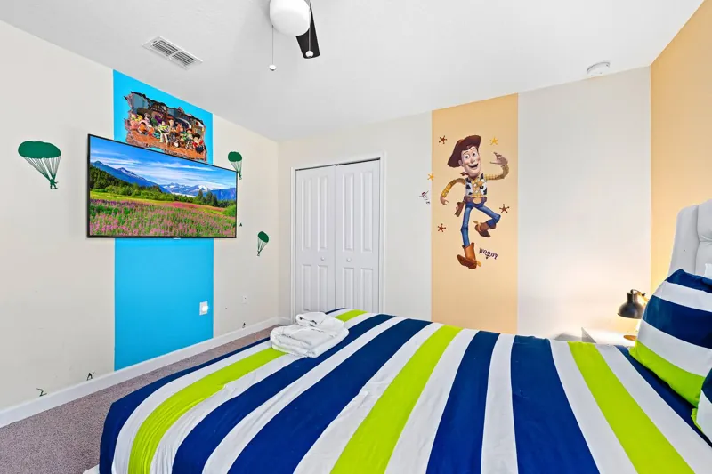 Toy Story bedroom with Woody mural and television